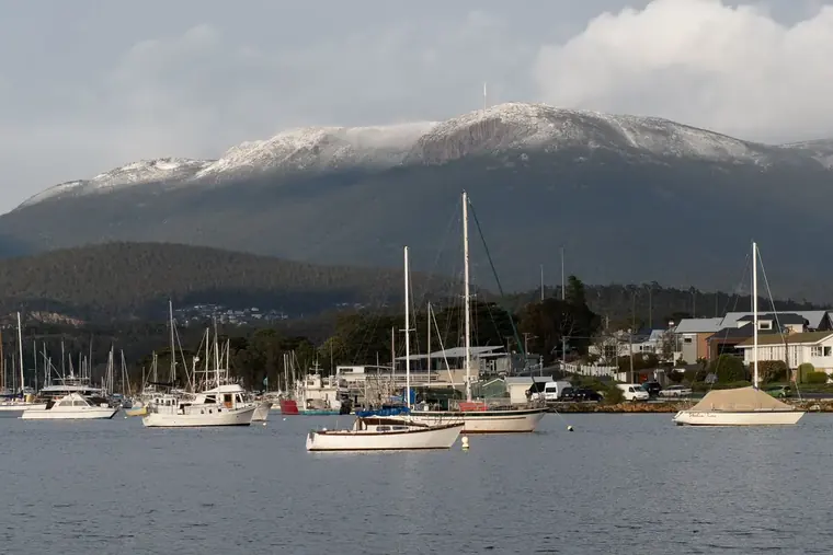 Yachts moored in Hobart below kunanyi / Mount Wellington.