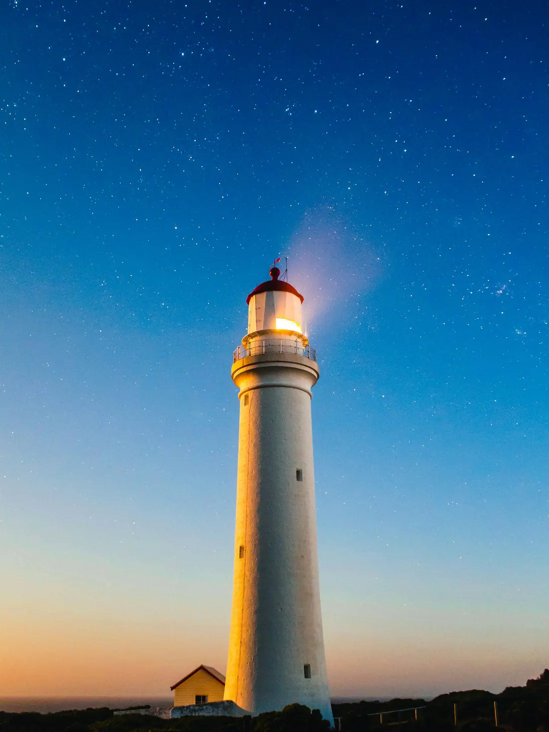 A lighthouse at dusk on the Victorian coast.